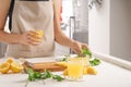 Woman preparing fresh lemon juice at table Royalty Free Stock Photo