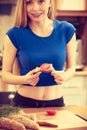 Woman preparing healthy breakfast making sandwich Royalty Free Stock Photo