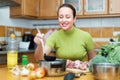 Woman preparing meal in kitchen Royalty Free Stock Photo