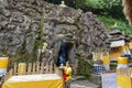 Woman preparing offering at Goa Gajah temple, Elephant cave, famous landmark Hindu, Bali, Indonesia,14.08.2018 Royalty Free Stock Photo