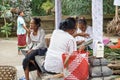 Woman preparing offering at Goa Gajah temple, Elephant cave, famous landmark Hindu, Bali, Indonesia,14.08.2018 Royalty Free Stock Photo