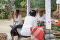 Woman preparing offering at Goa Gajah temple, Elephant cave, famous landmark Hindu, Bali, Indonesia,14.08.2018 Royalty Free Stock Photo