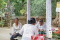 Woman preparing offering at Goa Gajah temple, Elephant cave, famous landmark Hindu, Bali, Indonesia,14.08.2018 Royalty Free Stock Photo