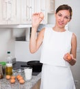 Woman preparing omelet Royalty Free Stock Photo