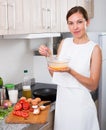 Woman preparing omelet Royalty Free Stock Photo