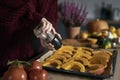 Woman preparing pumpkin for baking at home Royalty Free Stock Photo