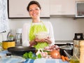 Woman preparing rice with meat at kitchen Royalty Free Stock Photo