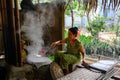 Woman preparing rice paper rolls in Vietnam