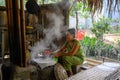 Woman preparing rice paper rolls in Vietnam