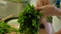 Woman preparing salad in the kitchen. Attractive girl while making salad in her kitchen at home Royalty Free Stock Photo