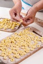 Woman preparing small ravioli