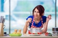 The woman preparing soup in the kitchen Royalty Free Stock Photo