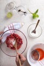 Woman preparing strawberry jam in her kitchen at home, top view Royalty Free Stock Photo