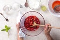 Woman preparing strawberry jam in her kitchen at home, top view Royalty Free Stock Photo