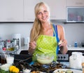 Woman preparing tigres espanol with mussels indoors