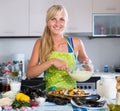 Woman preparing tigres espanol with mussels indoors