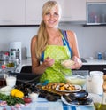 Woman preparing tigres espanol with mussels indoors