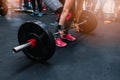 Woman preparing to barbell deadlift