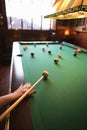 Woman preparing to hit pool ball. Royalty Free Stock Photo