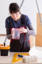 Woman preparing for wallpaper work Royalty Free Stock Photo