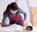 Woman preparing for wallpaper work Royalty Free Stock Photo