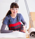 Woman preparing for wallpaper work Royalty Free Stock Photo