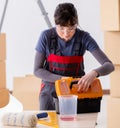 Woman preparing for wallpaper work Royalty Free Stock Photo