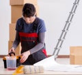 Woman preparing for wallpaper work Royalty Free Stock Photo