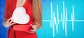 Woman present heartbox beside pulse line Royalty Free Stock Photo