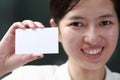 Woman presenting her business card Royalty Free Stock Photo