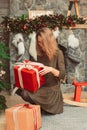 Woman with presents in Christmas interior Royalty Free Stock Photo