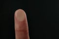 Woman pressing control glass of biometric fingerprint scanner on dark background, closeup. Royalty Free Stock Photo