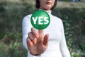Woman pressing the green Yes button. Concept of making a choice Royalty Free Stock Photo