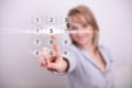 Woman pressing modern light with numbers button Royalty Free Stock Photo