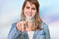 Woman pressing numerical button on virtual touch screen Royalty Free Stock Photo