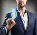 Woman pressing on virtual button with dactyloscopy scanner.