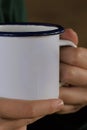 Woman with pretty hands holding a white mug. Royalty Free Stock Photo