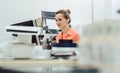 Woman in printing shop on the design computer Royalty Free Stock Photo