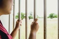 Woman prison missing hand at cage jail no freedom Royalty Free Stock Photo