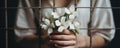 Woman Prisoner Holds White Flowers In Prison Authenticity