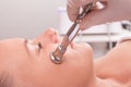 Woman while procedure jet peeling, facial treatmen