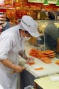 Woman produce raw fish fillet