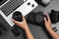 Woman with professional photographer equipment and laptop