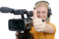 Woman with professional video camera,showing thumbs up Royalty Free Stock Photo