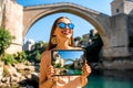 Woman promoting tourism in Mostar city