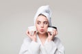 Woman proposing a cosmetics product. Gestures for advertisement.