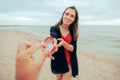 Woman Proposing to Her Beloved Partner at the Beach