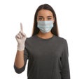 Woman in protective mask and medical gloves with raised index finger on white background Royalty Free Stock Photo