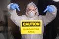 Woman in protective suit and in protective medical mask showing sign. Epidemiologist show stop palm. Stop coronavirus or Royalty Free Stock Photo