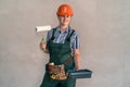 Woman in protective uniform with painting tools Royalty Free Stock Photo